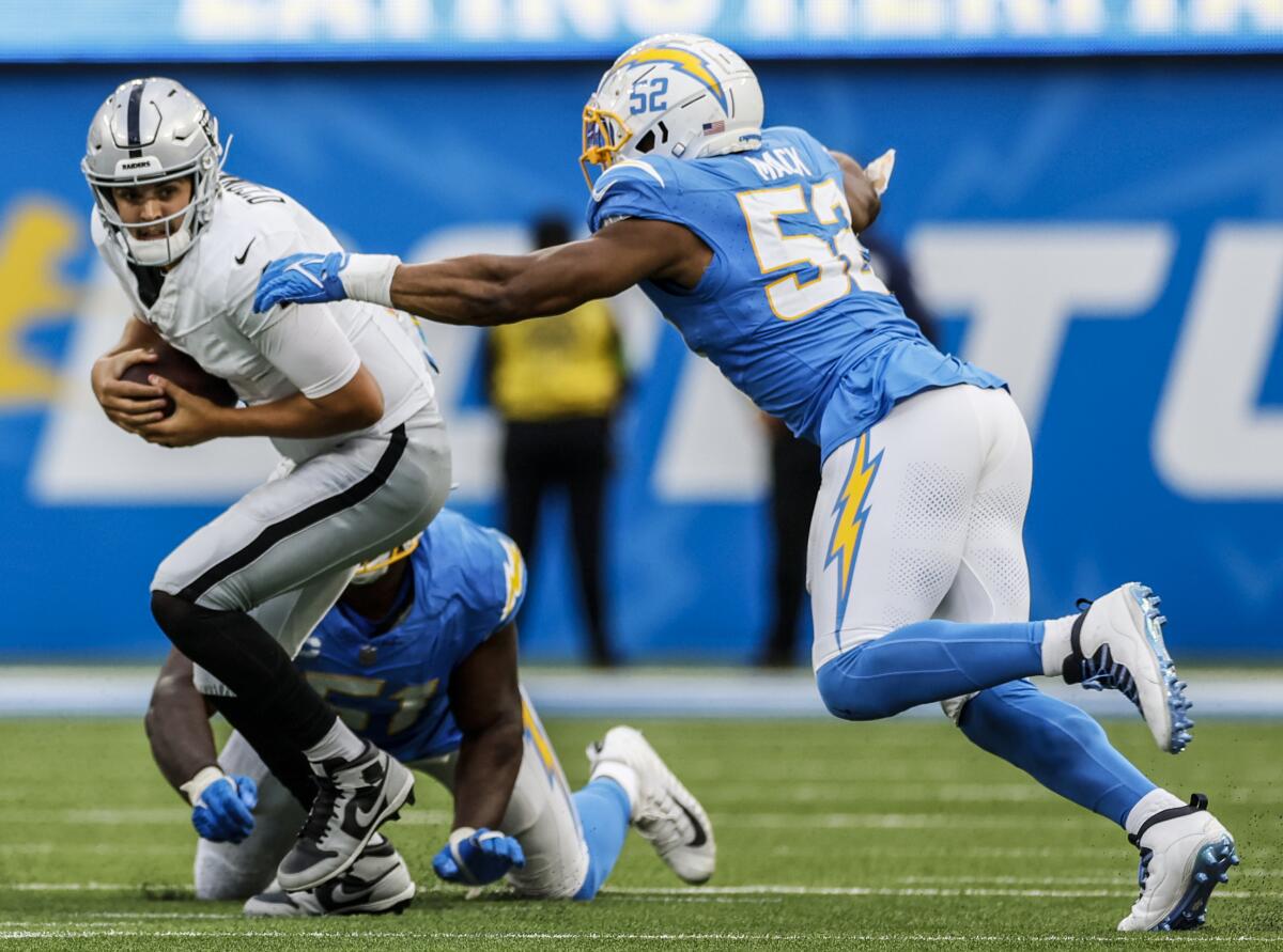 Chargers linebacker Khalil Mack closes for a sack of Raiders quarterback Aidan O'Connell.