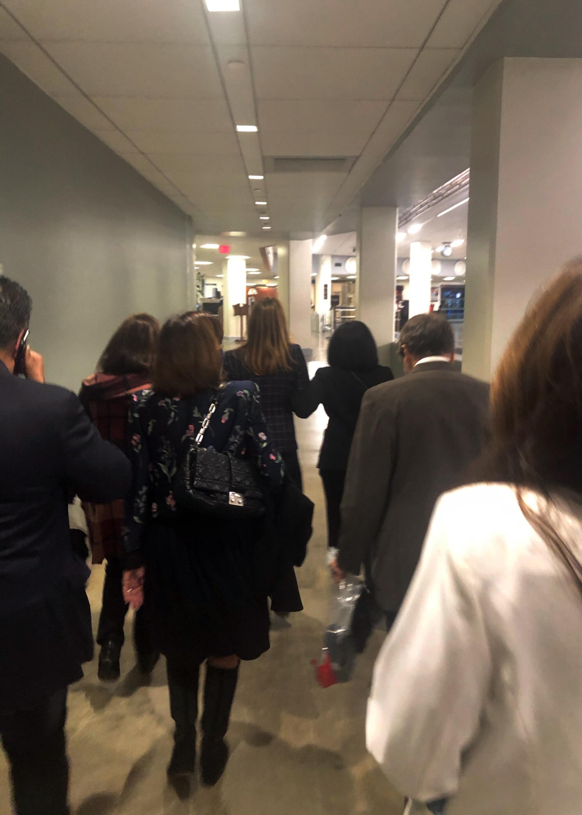 House members hustle down a tunnel under the Capitol 