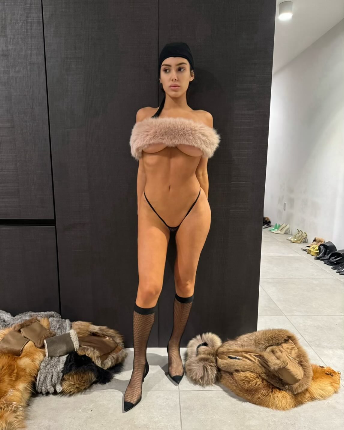 Kanye posted a risky photo of Bianca on Tuesday with a fur strap across her breasts