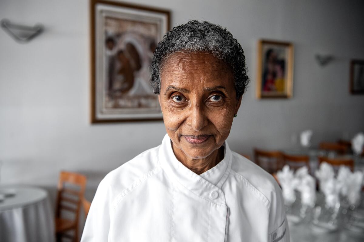 A chef in a restaurant's dining room