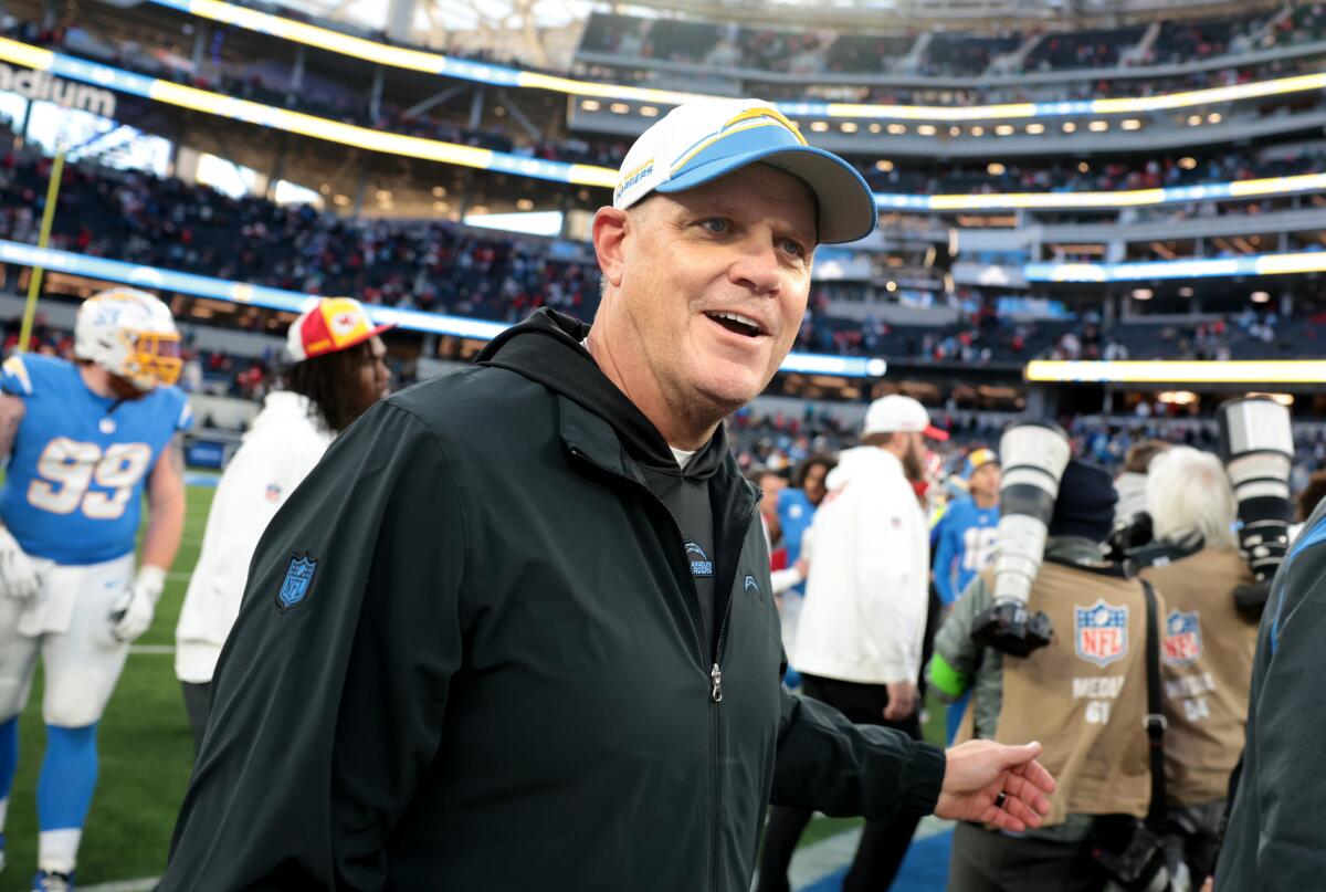 Chargers interim head coach Giff Smith walks off the field after losing to the Chiefs. He was 0-3 as interim coach.