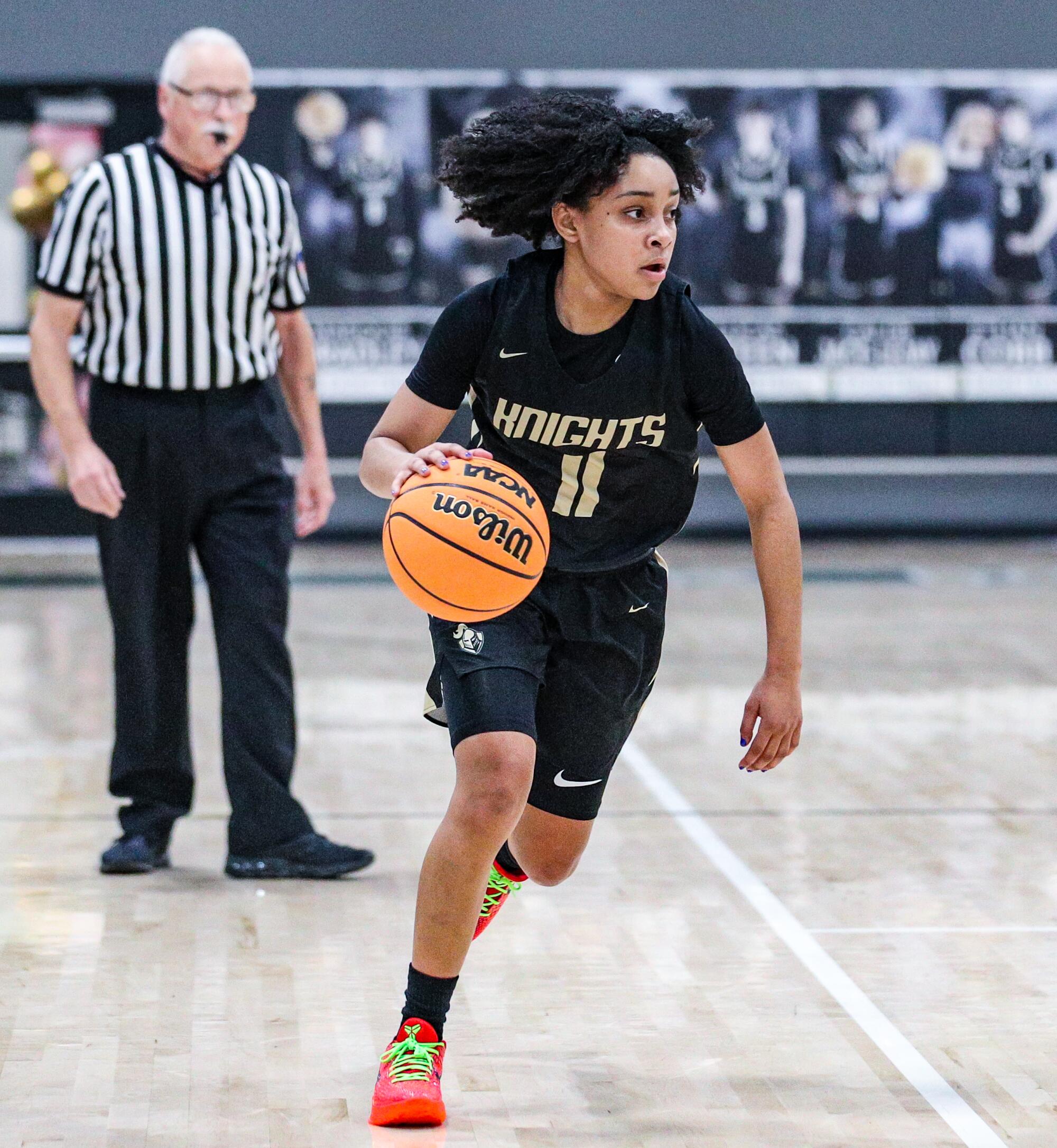 Freshman guard Kaleena Smith of Ontario Christian High dribbles the ball up court.