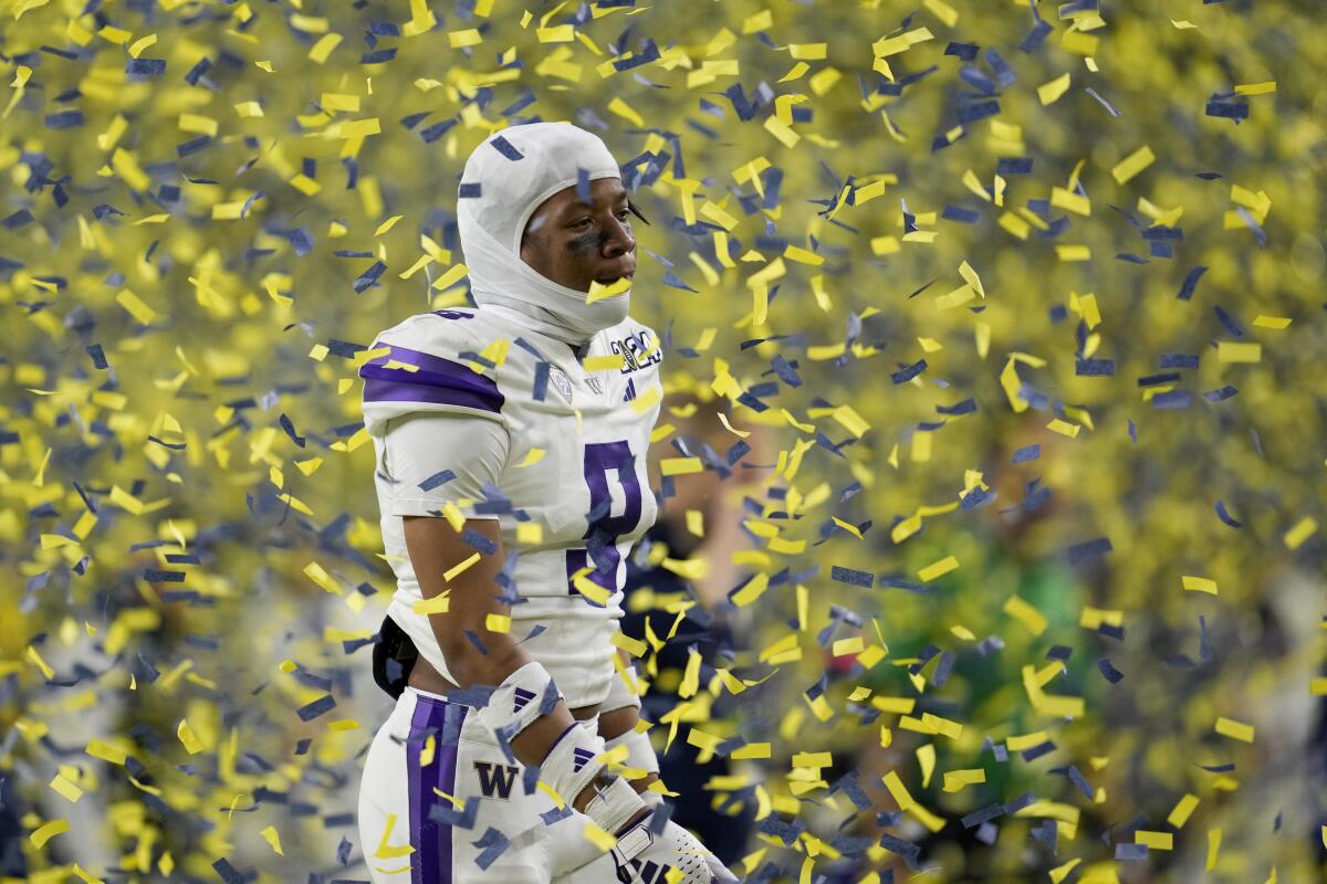 Washington defensive end Bralen Trice walks off the field following the Huskies' loss in the national championship game.