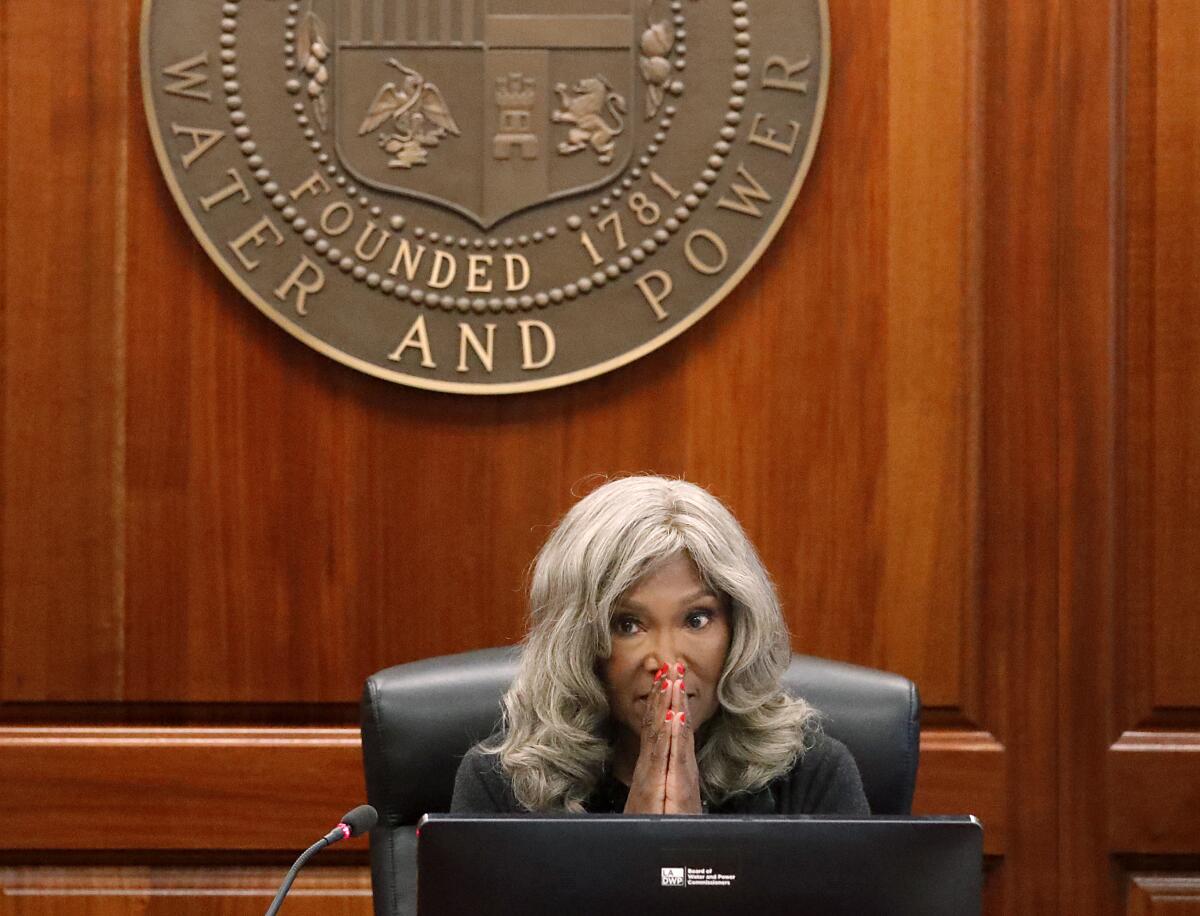 Cynthia McClain-Hill listens to public comments.