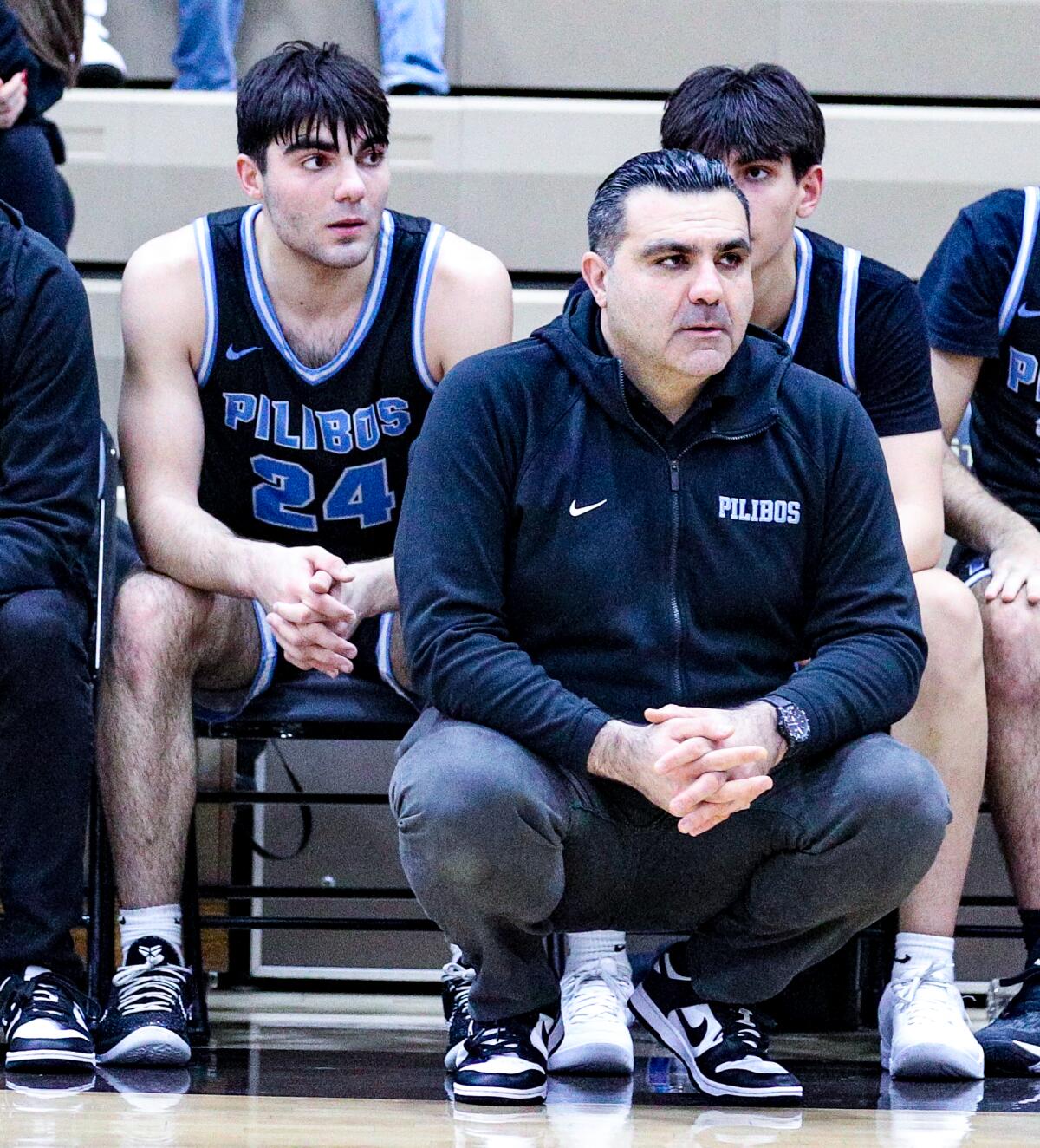 Junior guard Anto Balian, left, and Pilibos coach Sarkis Balian, his father.