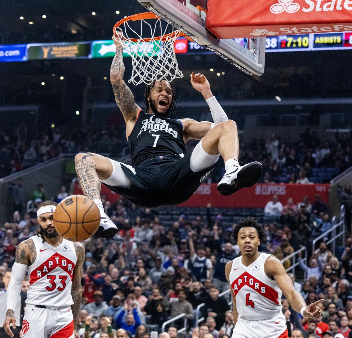 Clippers guard Amir Coffey dunks the ball in the first half.