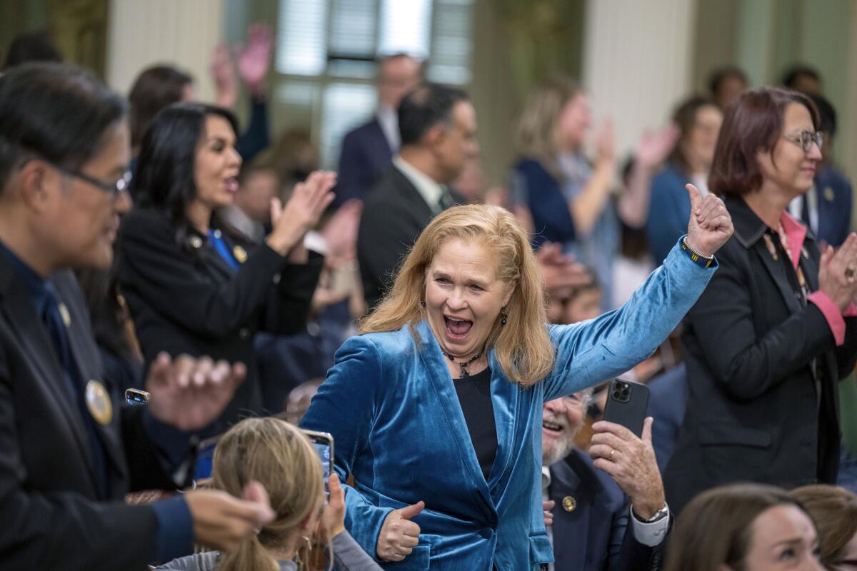 Assemblymember Gail Pellerin (D-Santa Cruz) celebrates after being sworn into office in 2022.