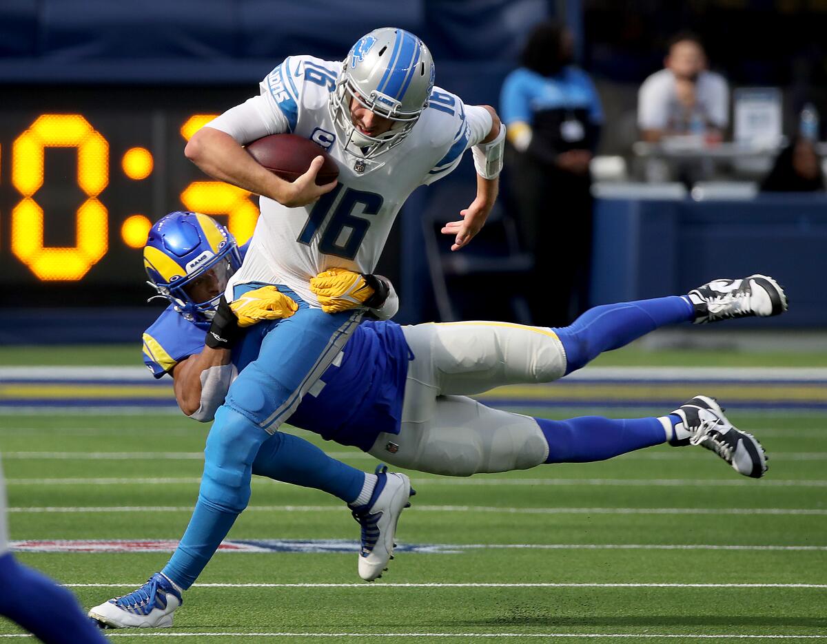 Lions quarterback Jared Goff is tackled during a game against the Rams at SoFi Stadium in 2021. 