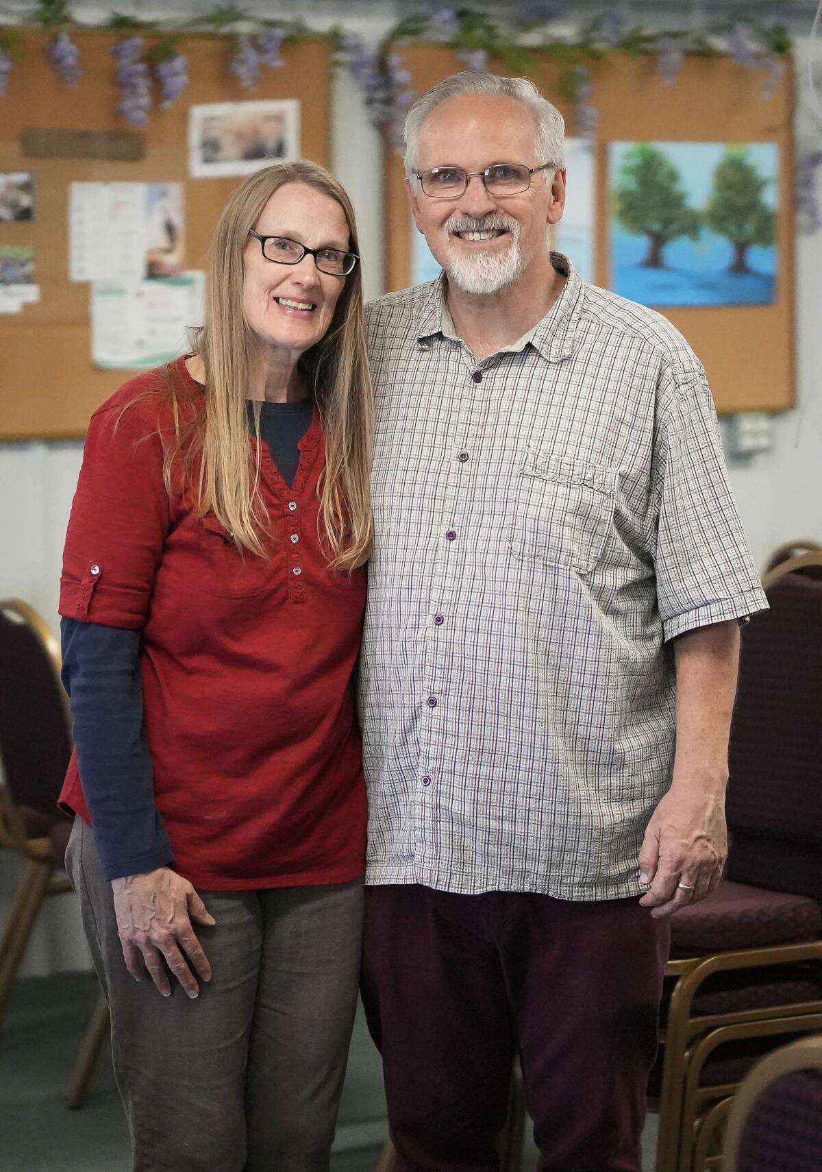 Kevin and Laurie Willson, both pastors at the Calvary Chapel in Ames, Iowa, in the worship hall at the church.