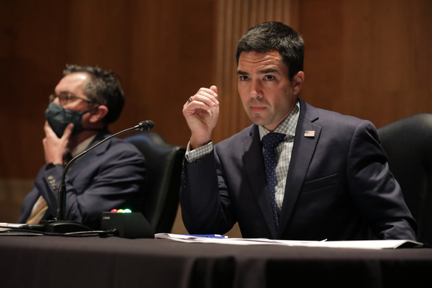 David Dinielli, left, and Carl Szabo, sit at a desk during a Senate hearing. 