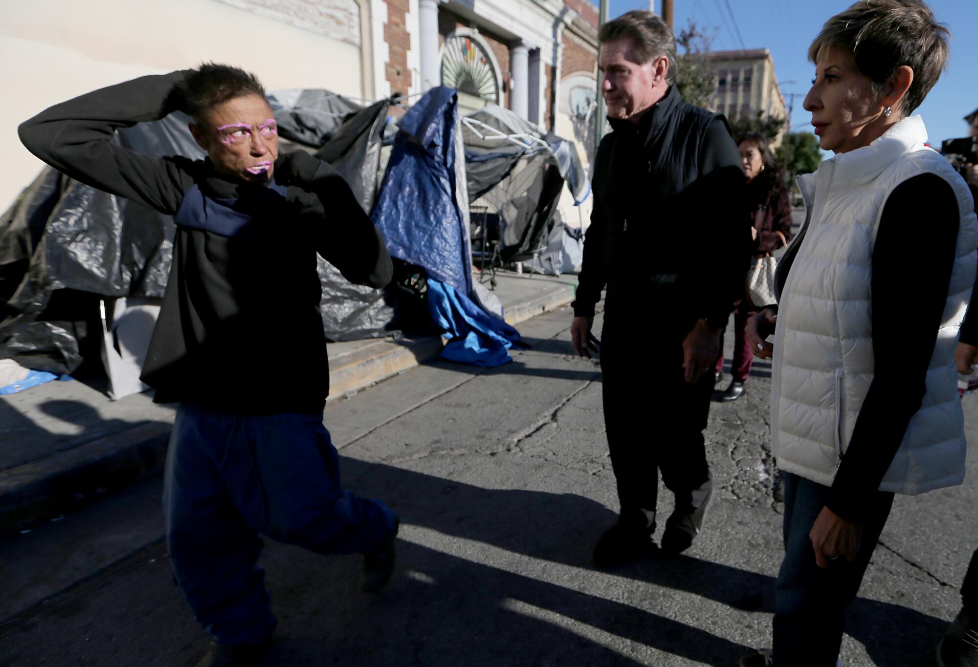 Steve Garvey, center, visits Los Angeles' Skid Row.