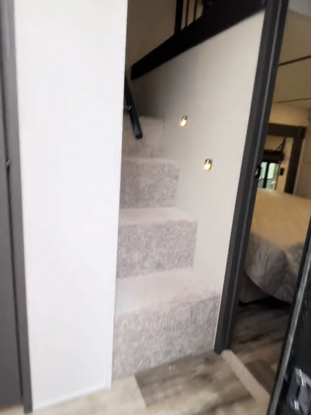 The staircase inside leads to the loft on the second floor