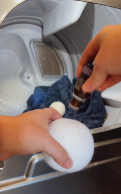 Next, she dried the towels with wool balls doused in essential oils