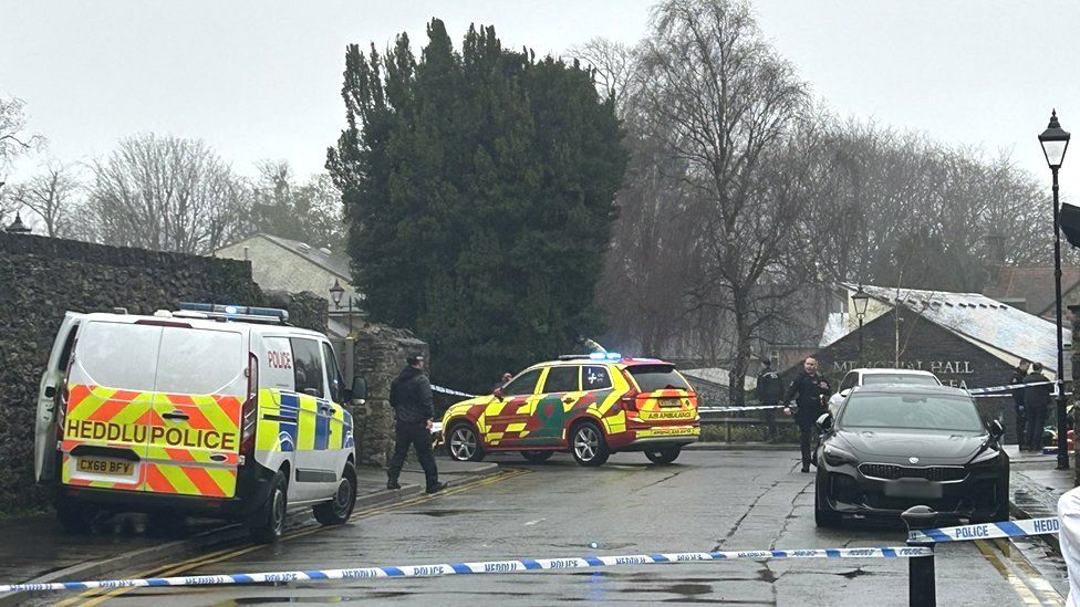 Police tape remained at the scene last week, with flowers also left there