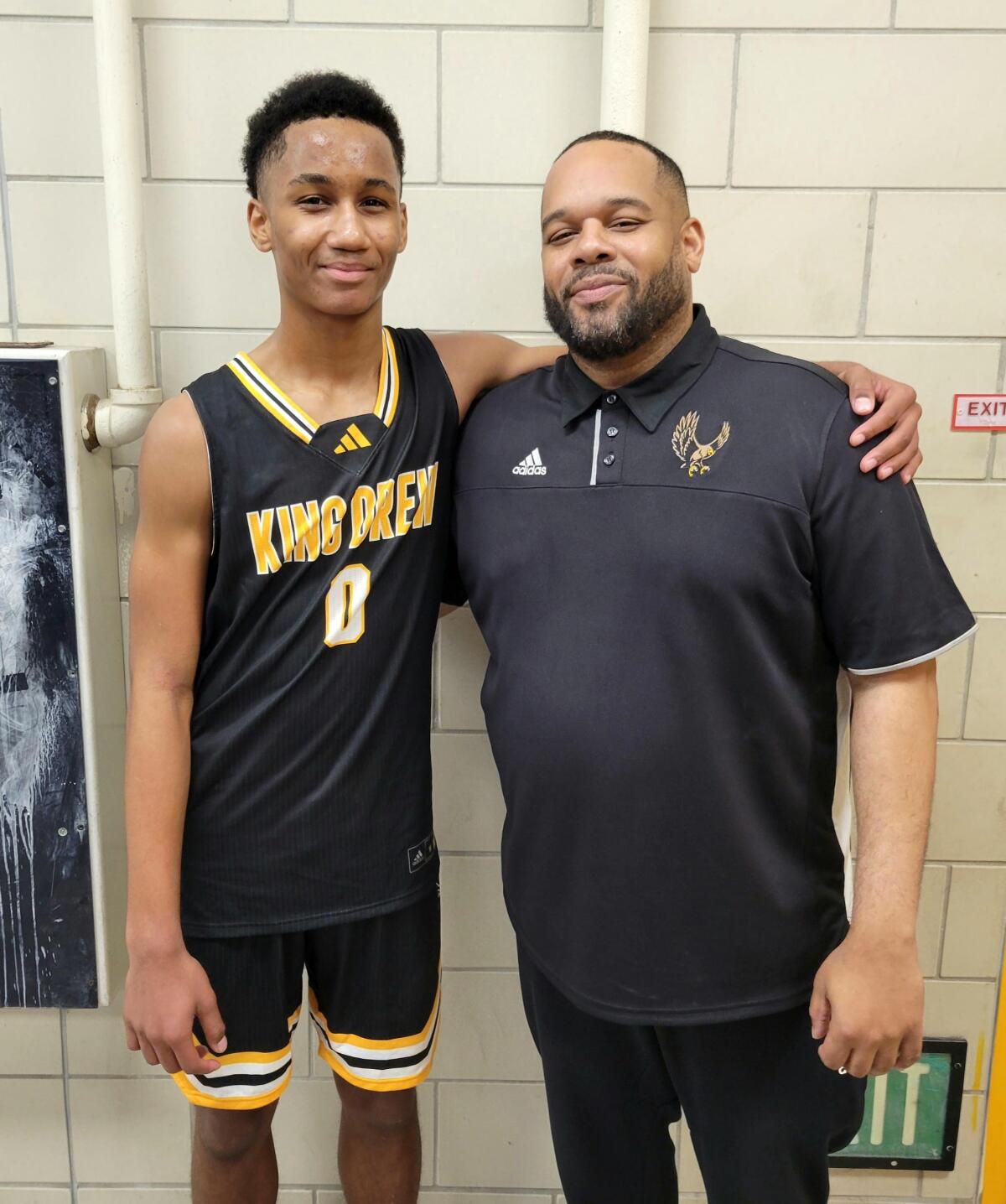 King/Drew coach Lloyd Webster with his son, Josahn, a sophomore guard who scored 18 points in win over Crenshaw.