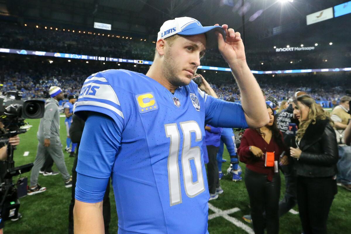 Jared Goff touches his cap and walks off the field.