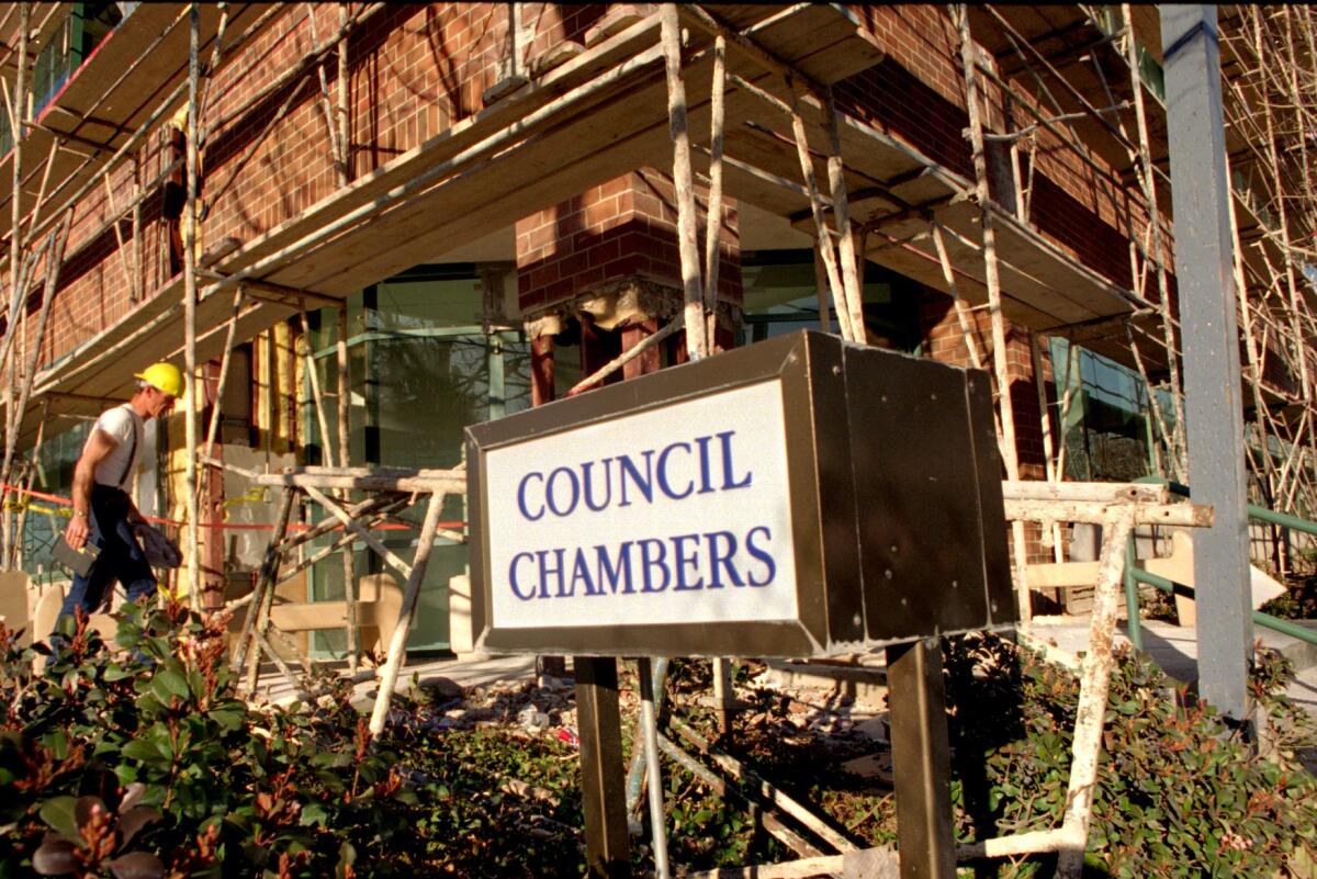 A construction worker enters the Santa Clarita City Hall.