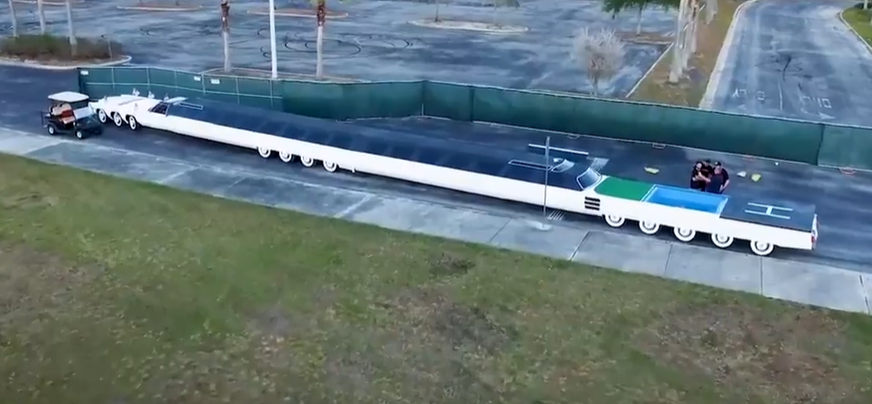 A view of the giant limo, with its pool and helipad at the back