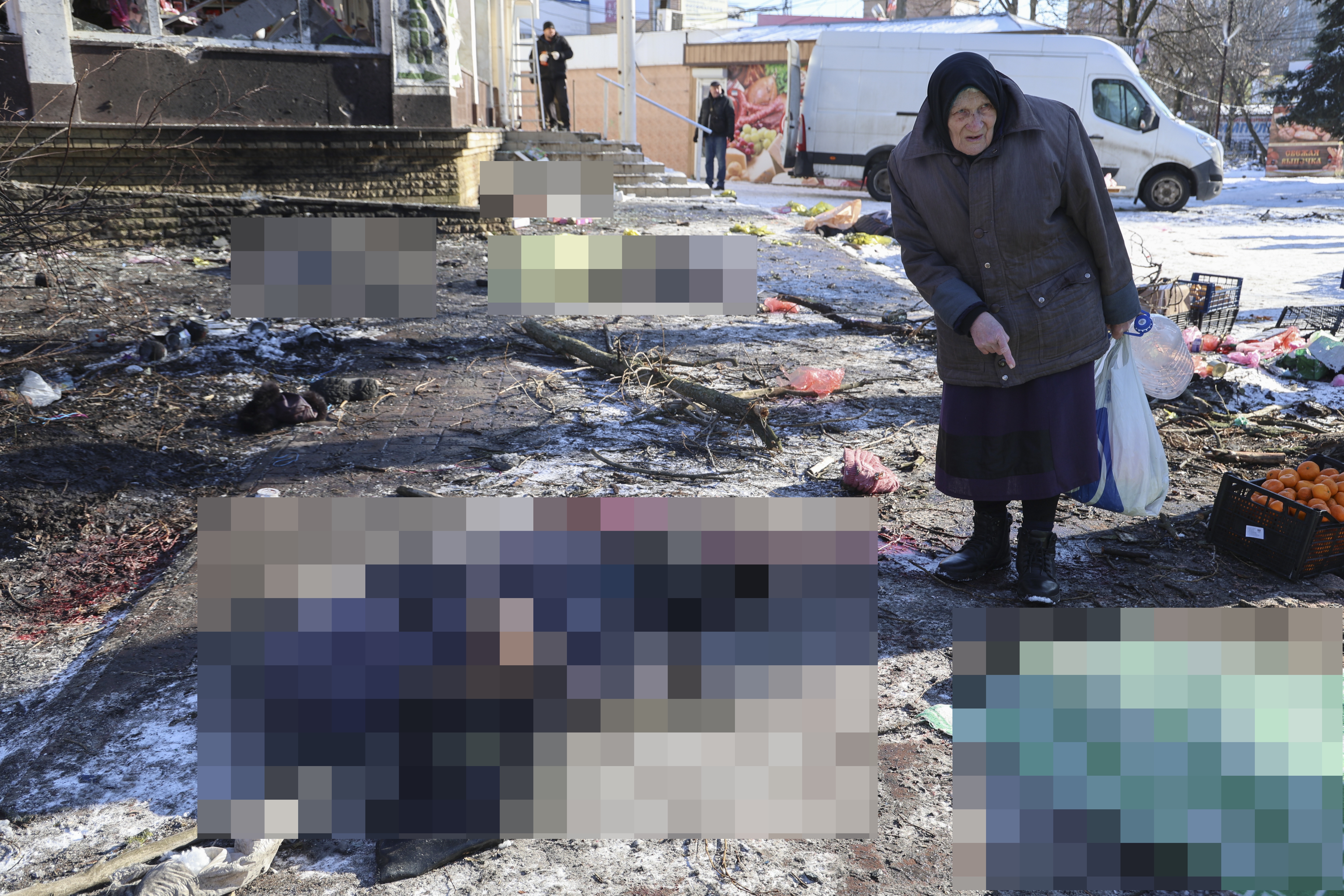 Bodies could be seen lying on blood-soaked snow near one of the city's markets