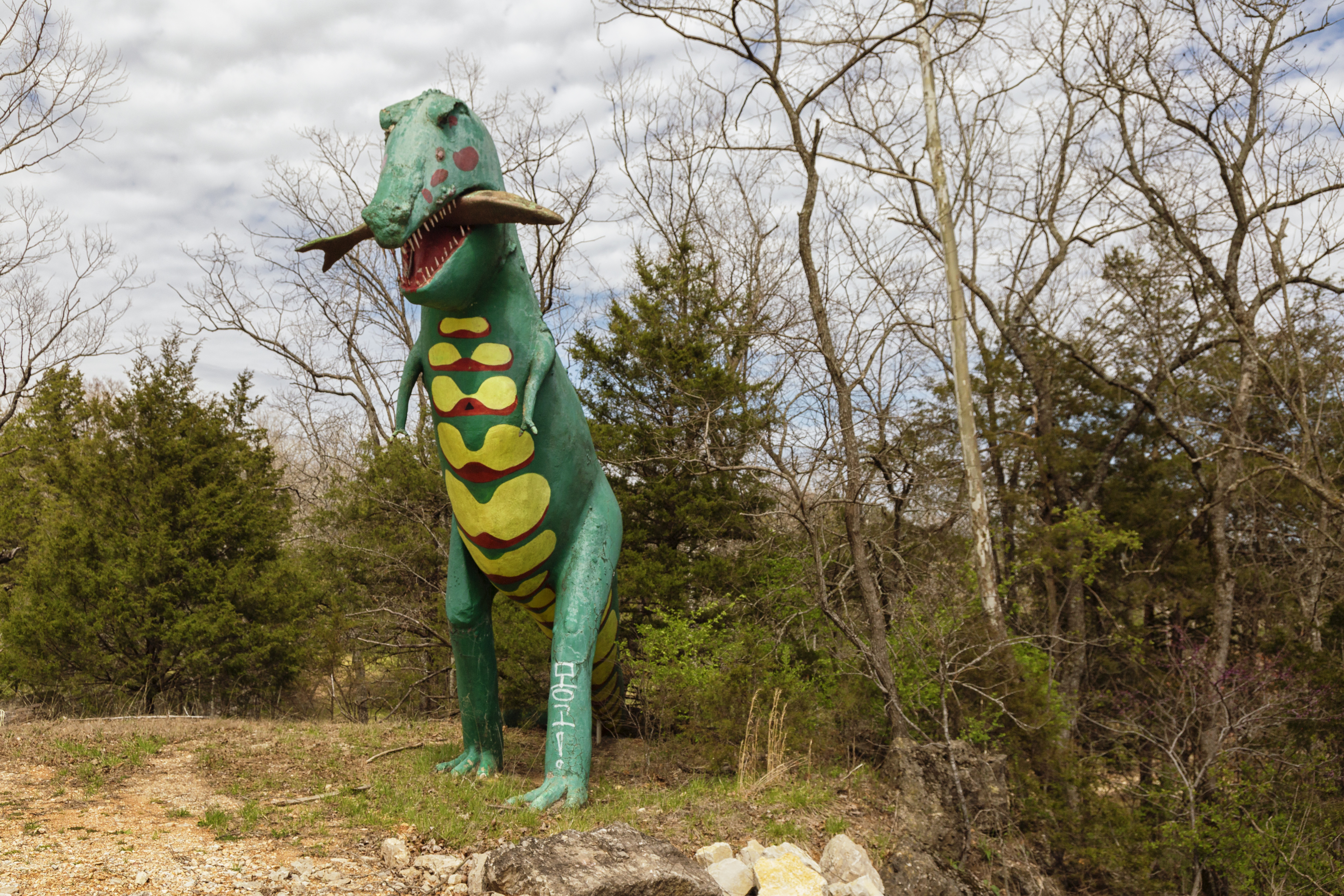 Huge dinosaurs are littered across the landscape