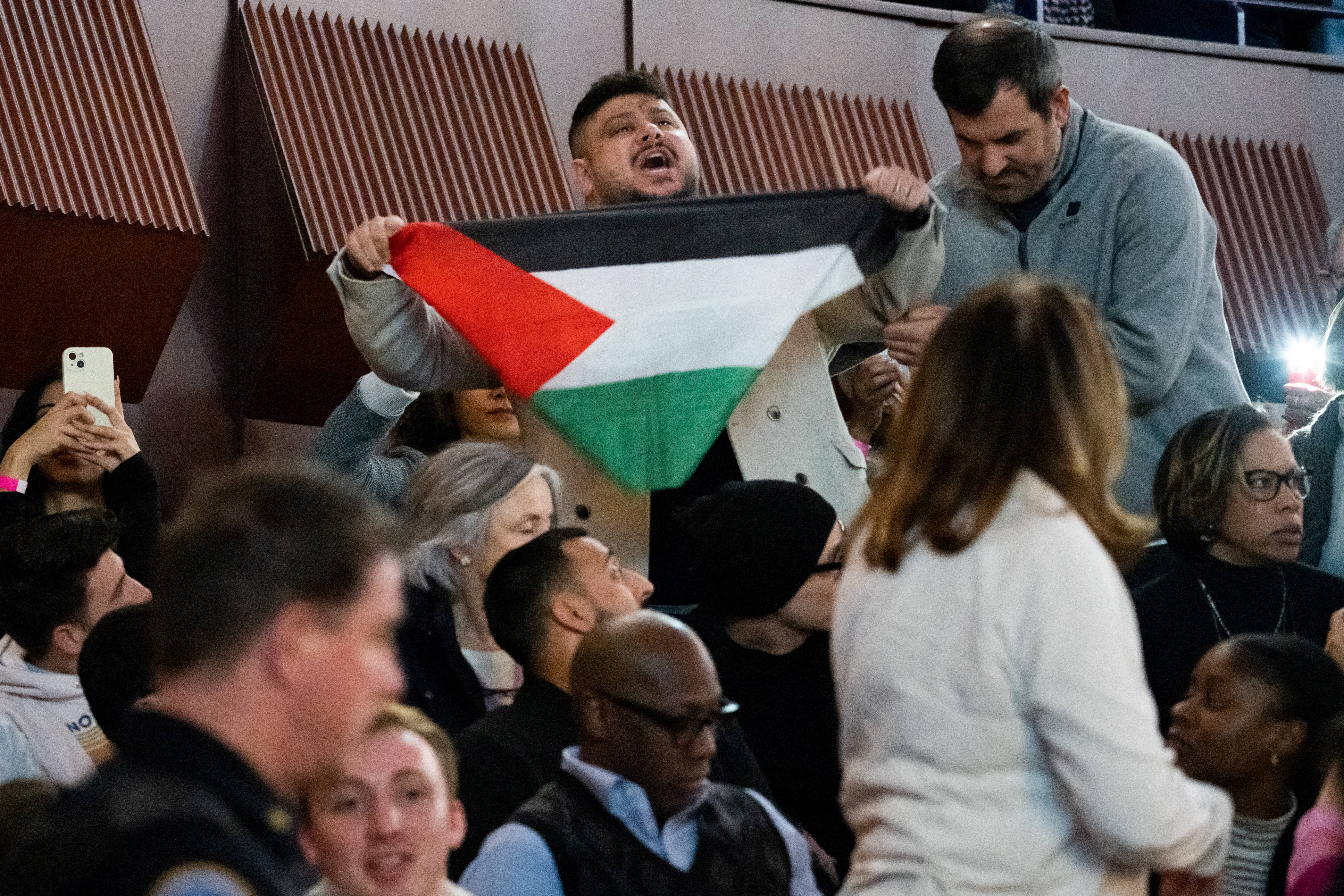 A pro-Palestinian protestor shouts in support of Gaza as US President Joe Biden speaks during a campaign rally to Restore Roe in Virginia