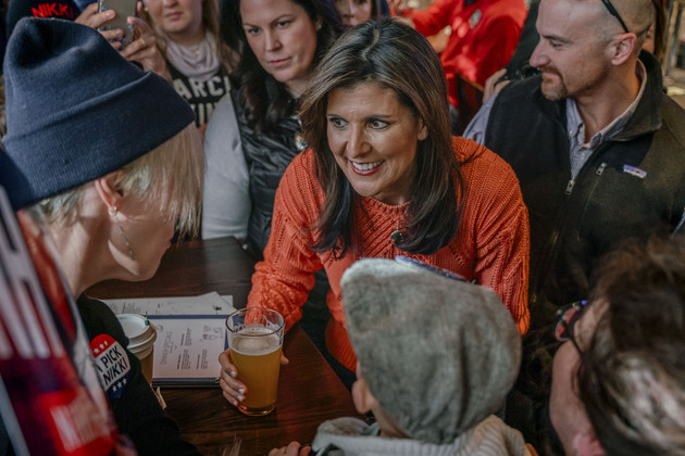 Republican presidential candidate Nikki Haley talks with supporters at T-Bones Restaurant.