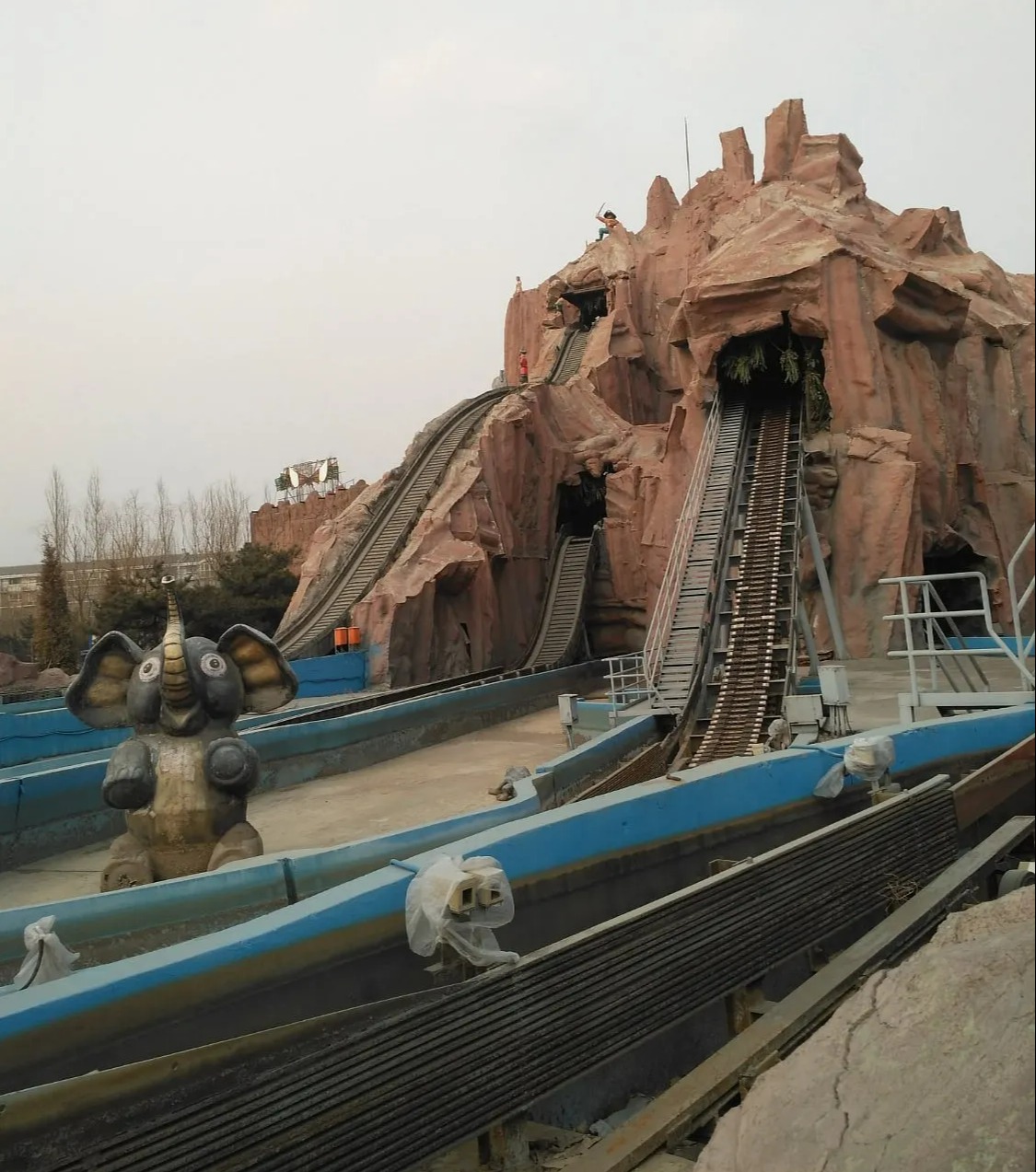 The atmosphere is eerie across the park and its various rides