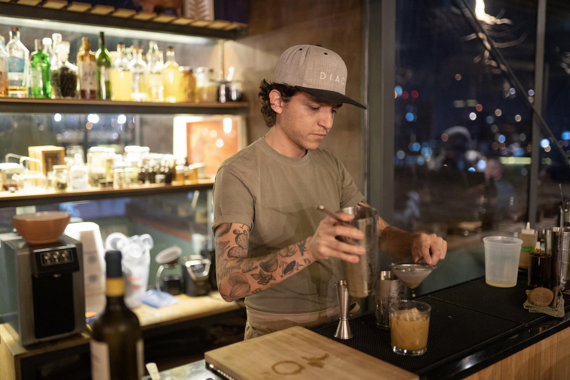Diacá bar manager Manuel Montepeque prepares drinks with local Guatemalan fruits, including jocote and mamey.