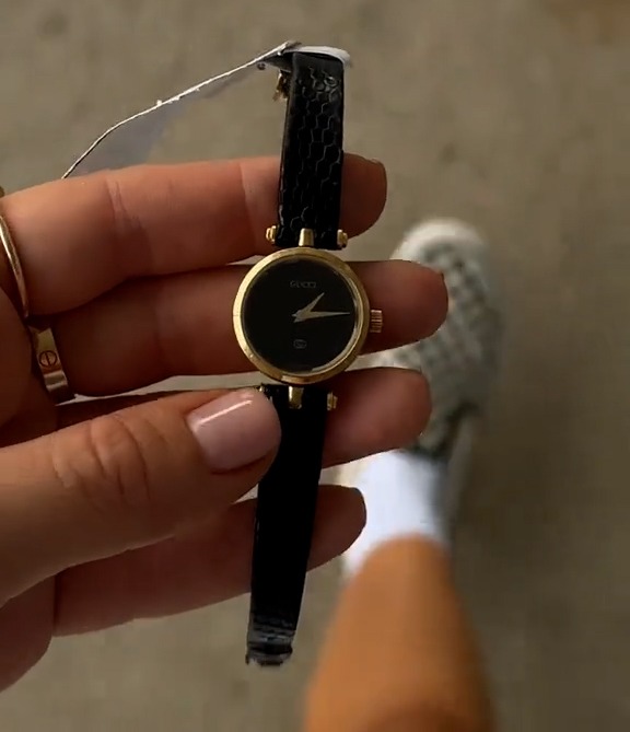 She showed off a gold-rimmed Gucci watch she found