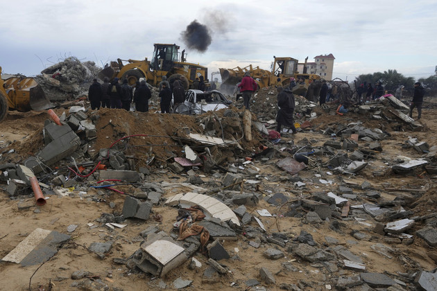 Palestinians search for bodies after an Israeli strike in Zuweida, Gaza Strip, on Jan. 29, 2024.  