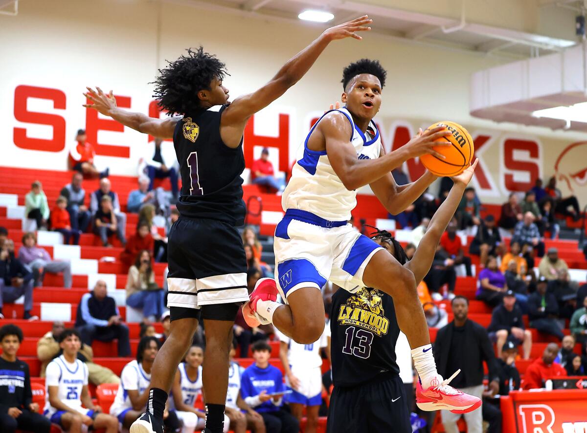 Windward guard Gavin Hightower goes up for a shot against Lynwood.