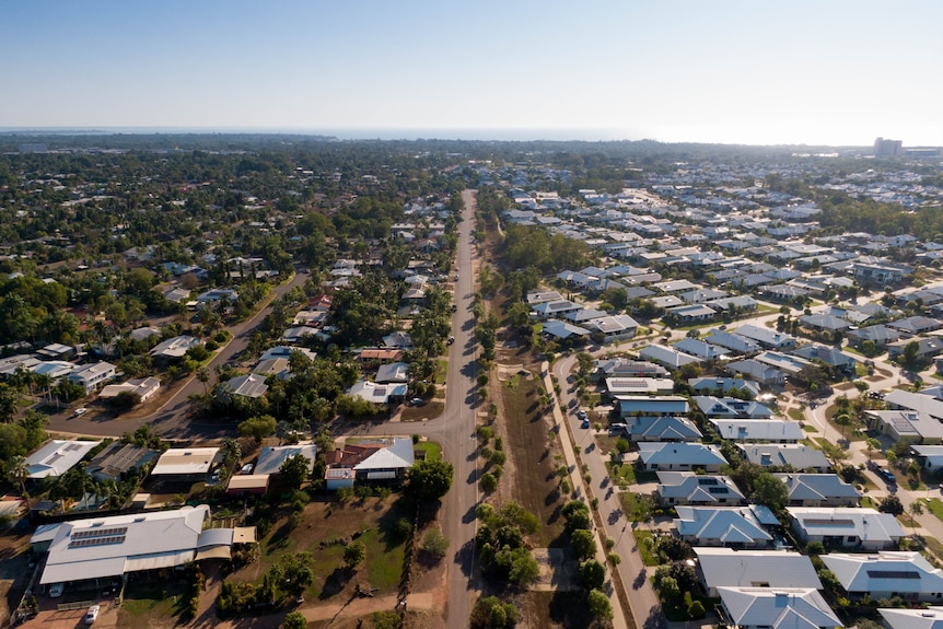 An aerial view of the roofs of houses in a suburb. 