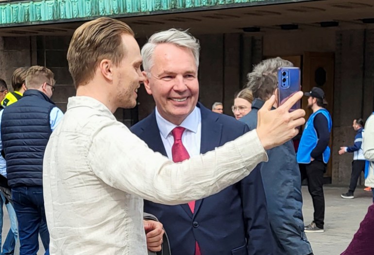 Finnish Foreign Minister Pekka Haavisto meets Helsinkians after his presidential campaign launch, at Helsinki railway station, Finland, June 8, 2023. REUTERS/Anne Kauranen