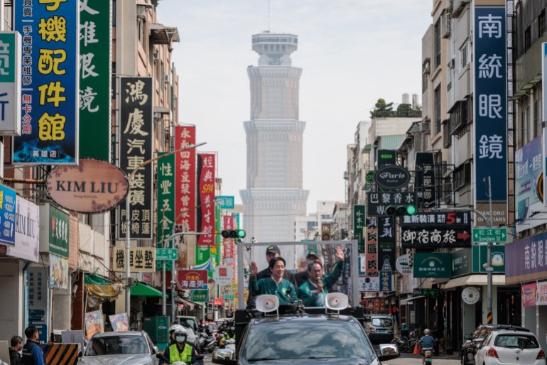 Taiwan's Vice President and presidential candidate of the ruling Democratic Progressive Party (DPP) William Lai Ching-te. He is standing in an open top vehicle on his way through the streets of in Kaohsiung to greet supporters.