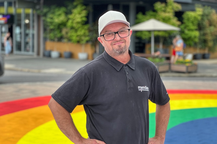 A man with glasses and a hat.