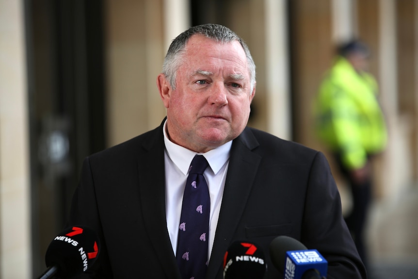 A mid-shot of WA opposition energy spokesman Steve Thomas outside parliament in a suit and tie.