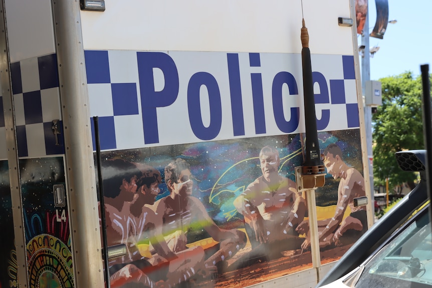 An Aboriginal artwork below the words police