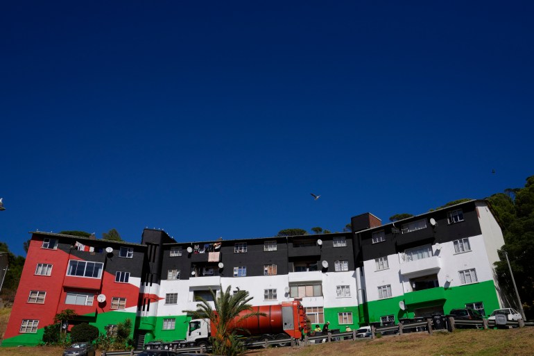 A view of an apartment building painted in the colours of the Palestinian flag, in the Bo-Kaap neighbourhood of Cape Town