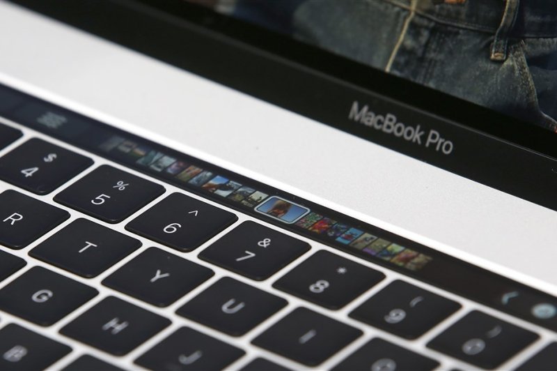 A Touch Bar on a MacBook Pro computer shown in a demo room at Apple headquarters in Cupertino, California on October 27, 2016. A Dutch company said it will stop selling important computer chip-making machines to China on Monday. File Photo by Tony Avelar/EPA-EFE