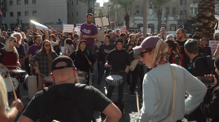 Protesters gather at the first anti-war protest in Israel since October 7 [Alasdair Brenard/Al Jazeera]