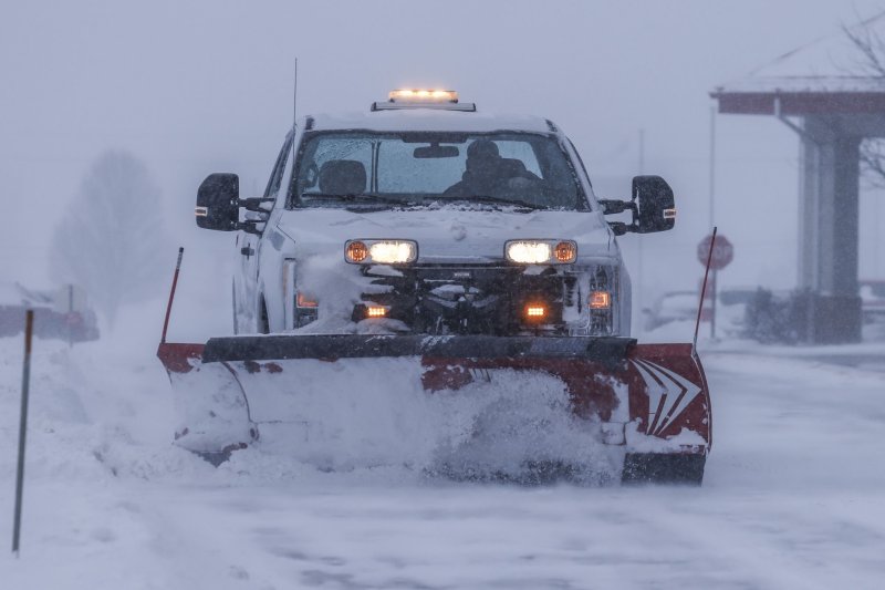 A truck with a snow plow clears a roadway as a winter storm hits the area dropping temperatures to extreme sub-freezing levels in Altoona, Iowa on Friday January 12, 2024. Republican presidential candidates campaigning for the Iowa Caucus have been forced to cancel events because of the dangerous weather conditions. Iowa Republican voters will gather to caucus on January 15th to select their candidate for US president. Another blast of Arctic air is forecast to hit the country through the middle of the week. Photo by Tannen Maury/UPI