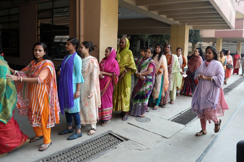 Women line up to cast their vote at Dhaka polling center Sunday, January 7, 2024, in a parliamentary election that delivered a fourth straight victory to the ruling Awami League party headed by Prime Minister Sheikh Hasina. Photo by Monirul Alam/EPA-EFE