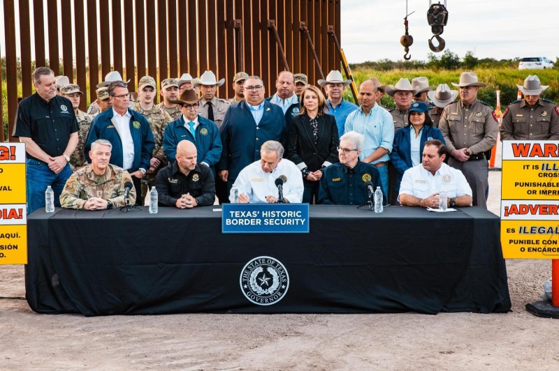 Texas Gov. Greg Abbott on Dec. 18 signed a series of border security laws at the Rio Grande Valley, including Senate Bill 4, which the Justice Department asked a judge to enjoin on Wednesday, stating it is unconstitutional. Photo courtesy Office of Texas Governor Greg Abbott/Facebook