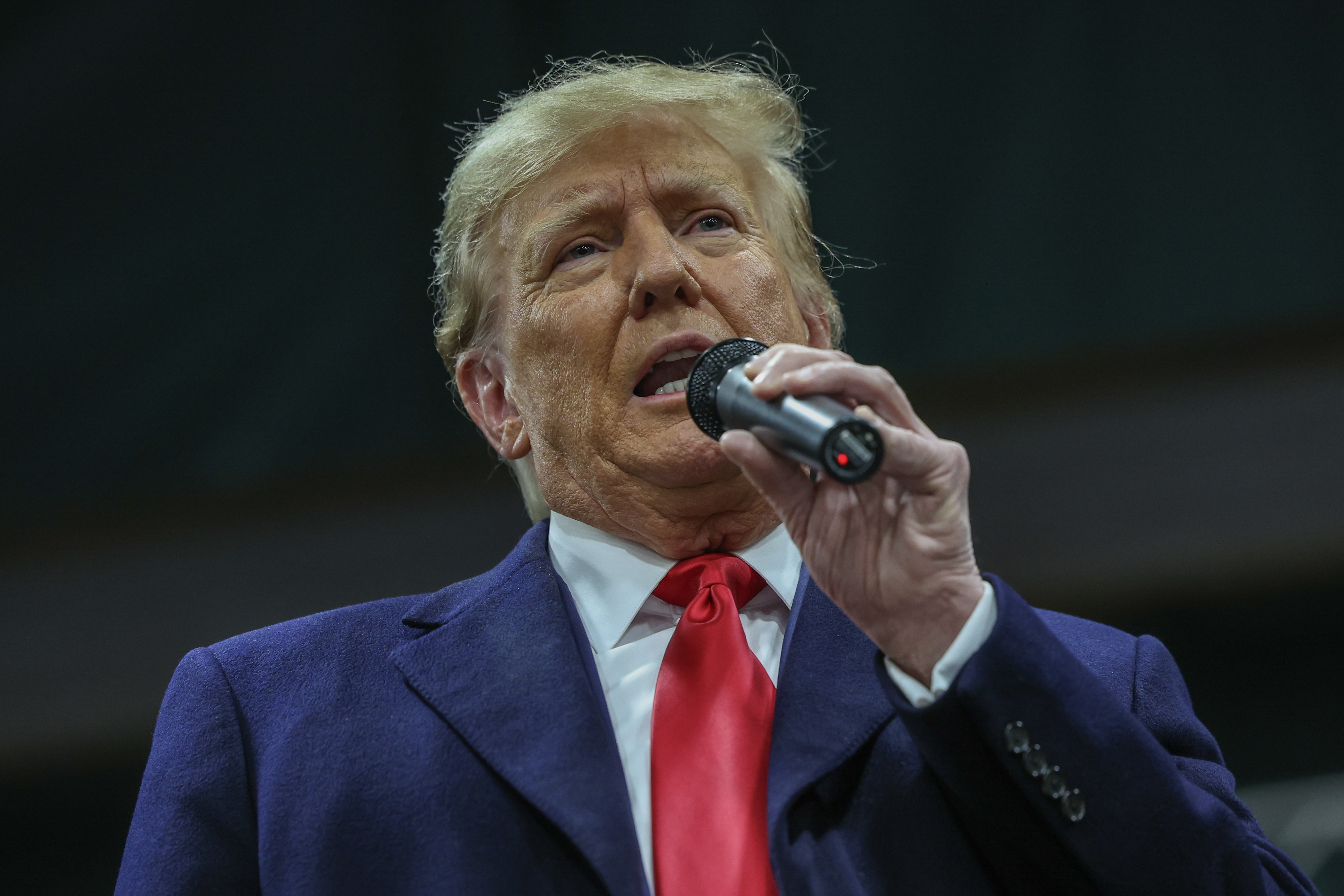 Former president Donald Trump speaks to voters during a visit to a caucus site at the Horizon Event Center on January 15, 2024 in Clive, Iowa