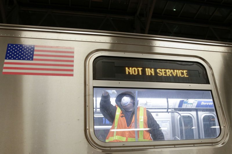 An MTA Worker cleans a subway car at the Coney Island Stop in May 2020 amid the coronavirus pandemic. File Photo by John Angelillo/UPI