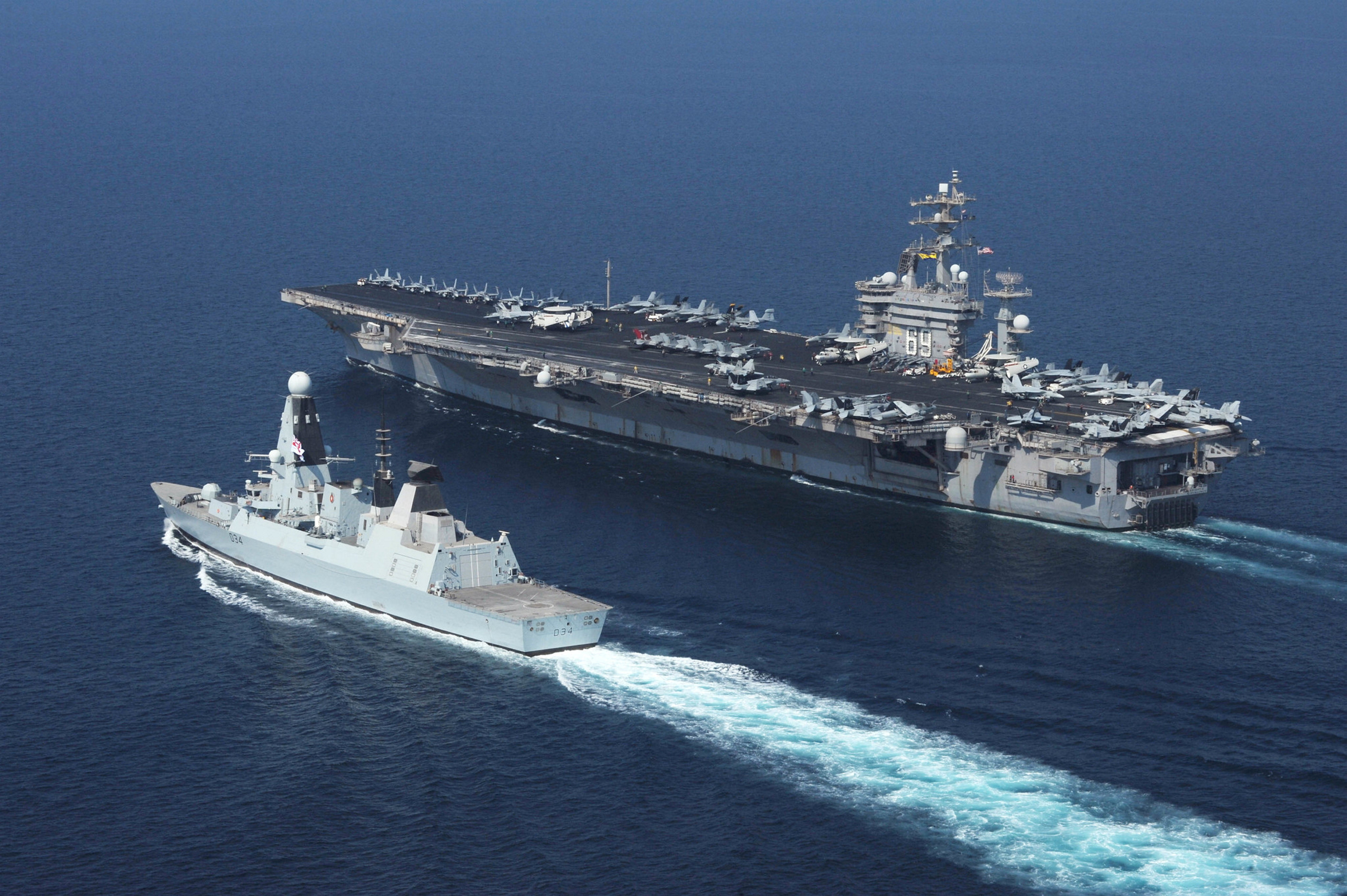 Royal Navy destroyer HMS Diamond alongside USS Dwight D. Eisenhower aircraft carrier in the Red Sea