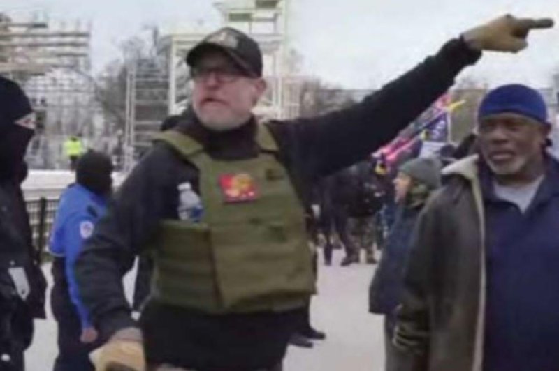 Proud Boys member William Chrestman, 51, of Olathe, Kan., is depicted during the Jan. 6, 2021, insurrection at the U.S. Capitol while carrying an ax handle. He was sentenced to 55 months in prison on Friday. File Photo provided by U.S. Dept. of Justice