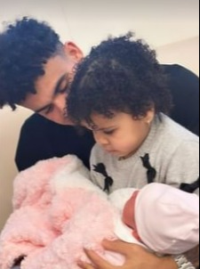 Luis Diaz is pictured with baby daughter Charlotte and her older sister Roma, 2, last night