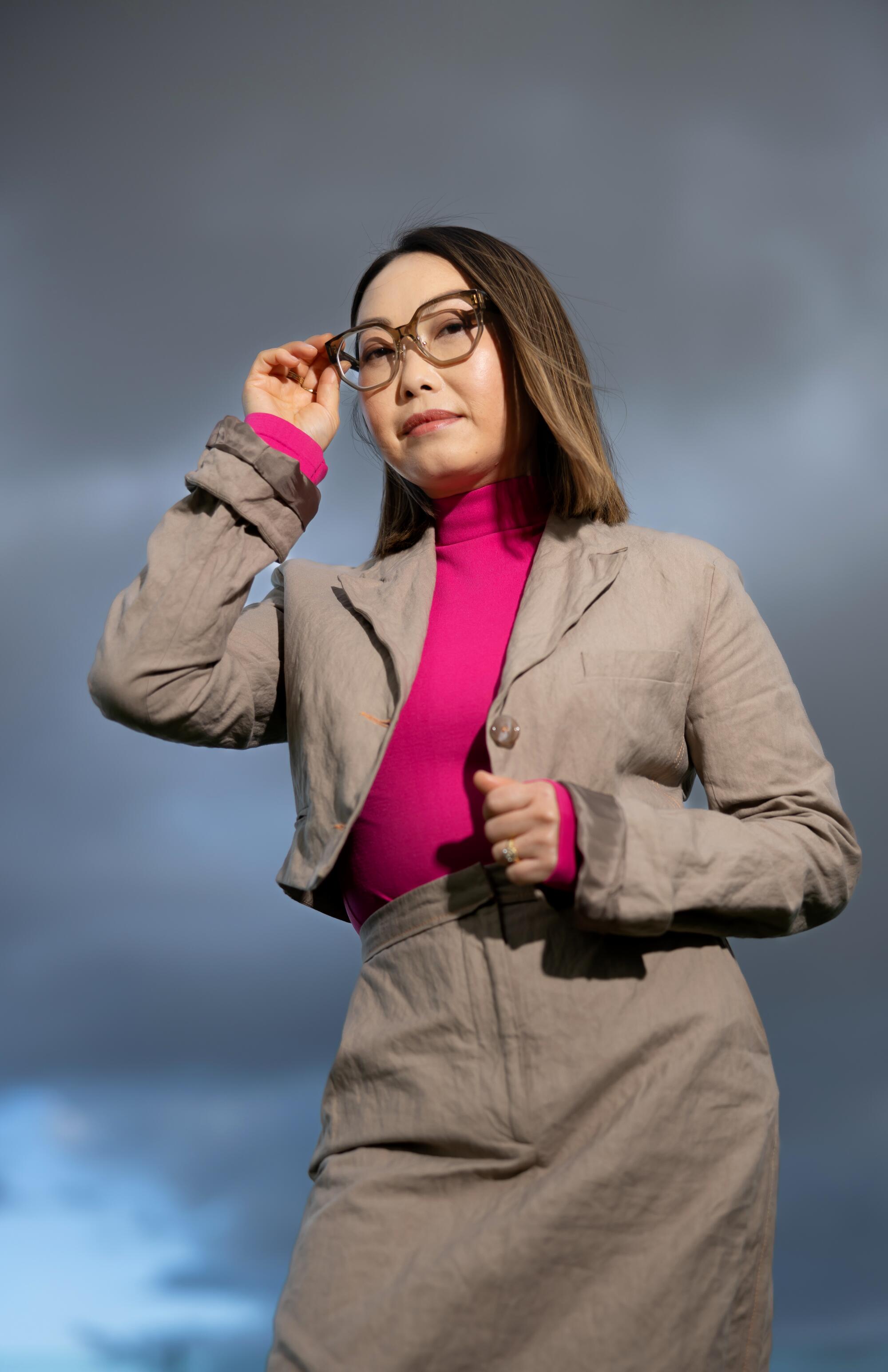 A woman wearing glasses.