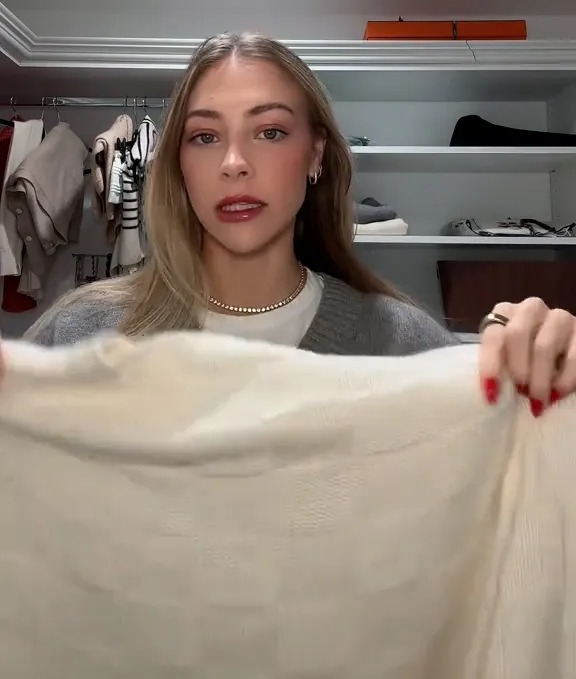 Influencer Hannah Chody shared a clever method she uses for hanging sweaters without stretching them out